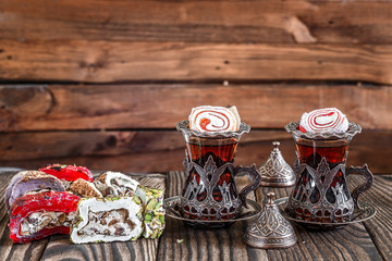 Fragrant Turkish tea and Turkish sweets in national dishes
