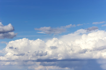 Blue sky with white clouds. Summer background.