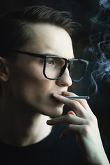 Fototapeta premium smoking young man
