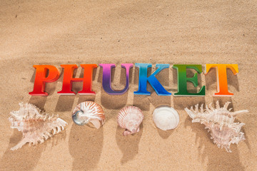 The name of the word Phuket in colorful color on the beach