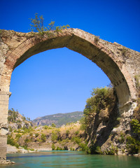 Fototapeta na wymiar Panorama view to old ruined bridge over Dalaman river, Turkey