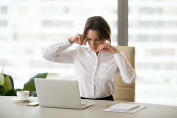 Fatigued businesswoman office worker feeling tired touching dry irritated eyes suffering from...