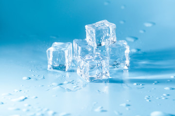 Naklejka na ściany i meble Pyramid of melted ice cubes with drops