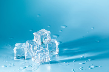 Pyramid of melted ice cubes with drops