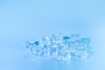 Pyramid of melted ice cubes with drops