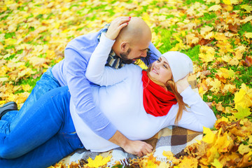 happy young couple   in the autumn park