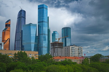Obraz premium Skyscrapers of Moscow City on the background of old houses