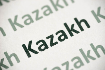 word Kazakh language printed on paper macro