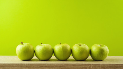 Jewish holiday Rosh Hashanah background with green apples