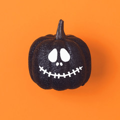 Halloween holiday concept with jack o lantern glitter  pumpkin decor