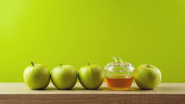 Jewish holiday Rosh Hashanah background with honey and apples