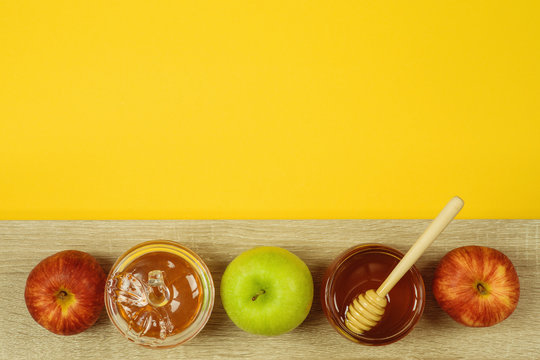 Jewish holiday Rosh Hashanah background with honey and apples