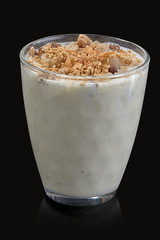 Cold, fresh summer milkshake  with nuts.