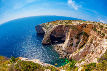 Fisheye view of the Blue Grotto in Malta at springtime