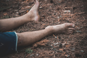 corpse of a man in the woods