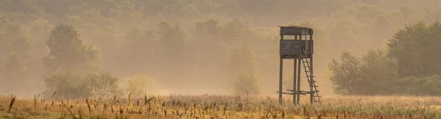 Foto op Aluminium hunting tower in the valley in the morning mists © Mike Mareen