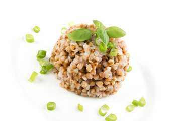 Bowl of Buckwheat Porridge Isolated on White Background Top View