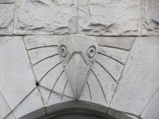 An interesting architectural detail on the facade of the building is a bird