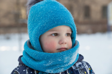 Portrait of boy in winter outdoors