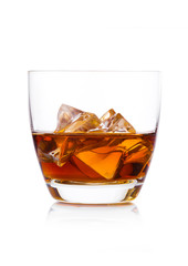 Glass of whiskey with ice cubes on white. Cognac brandy drink