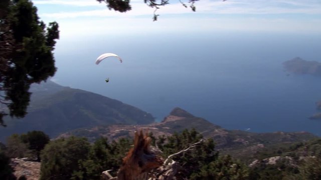 Extreme paragliding from mountain Babadag in Turkey near the city of Fethiye. Best feeling of adrenaline, euphoria and freedom at height of bird's flight. Awesome energy of the ascending air currents.