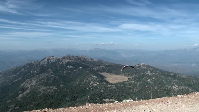Extreme paragliding from mountain Babadag in Turkey near the city of Fethiye. Best feeling of adrenaline, euphoria and freedom at height of bird's flight. Awesome energy of the ascending air currents.