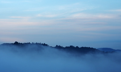 Evening skyline and misty valley