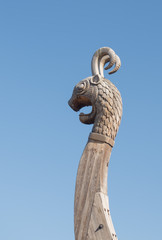 Wooden dragon figure on the nose of the Viking ship