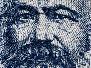 Karl Marx portrait on East German 100 mark (1975) banknote closeup macro, famous philosopher, economist, political theorist, sociologist and revolutionary socialist..