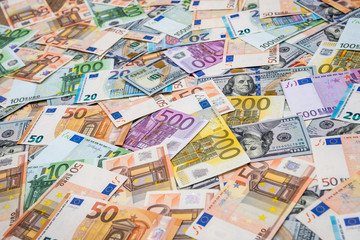 Obraz na płótnie Canvas Euro and dollars banknotes as background