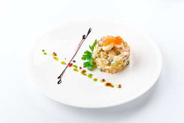 Olivier with mushrooms in a white plate, isolated on a white background. View from above, apartment. Close-up
