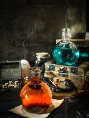 Blue and red magic potions with smoke