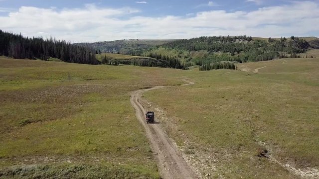 Drone behind an ATV in the Rockies