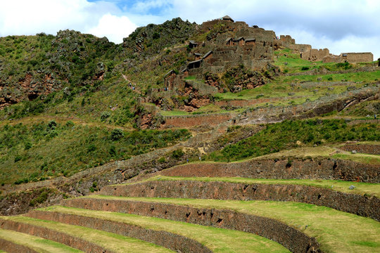 Inca agricultural terraces and the ancient ruins at Pisac Archaeological Complex, Sacred Valley of Cusco region, Peru 