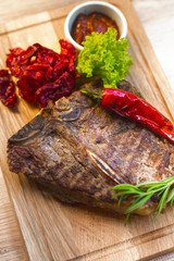 Appetizing steak on a wooden board