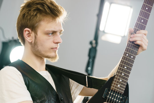 Man playing on electric guitar