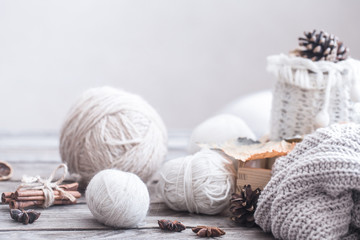 composition with thread for knitting, wooden background