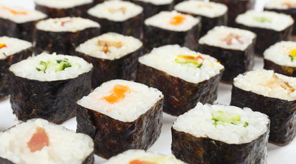 Traditional japanese sushi set on a white background close up.