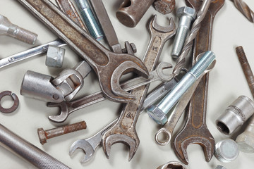 Variety of metal tools and parts for car repair close up