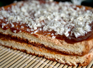 sweet cake with condensed milk, sprinkled with dough