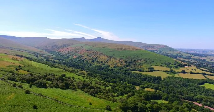 Mountain range, valleys with dry grasses, summer panorama, Brecon Becons, Wales, UK .
