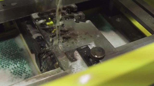 Metalwork. wire or spark erosion process of hardmetal machining with water cooling. Electrical discharge machine spark eroding with water process machine die mold in workshop