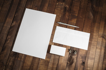 Photo of blank stationery set on wood table background. Corporate identity template. Responsive design mockup.