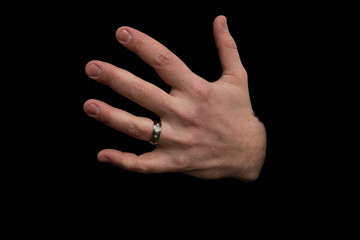 Husband's hand showing wedding ring