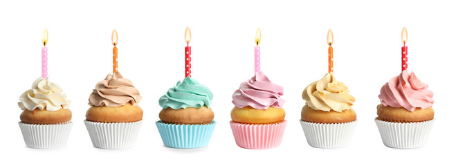 Set with birthday cupcakes and burning candles on white background
