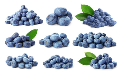 Set with fresh tasty blueberries and green leaves on white background