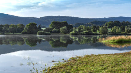 Fototapeta na wymiar Lake L'Oignin in France. Holiday summer morning.