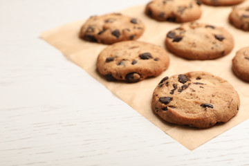 Tasty chocolate cookies on light table, closeup