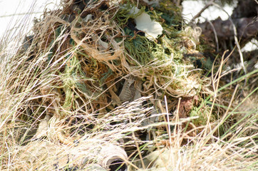 Sniper ghillie suit prone kneeling unsupported position hide in the trees