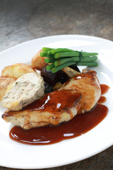 plated chicken with vegetables meal